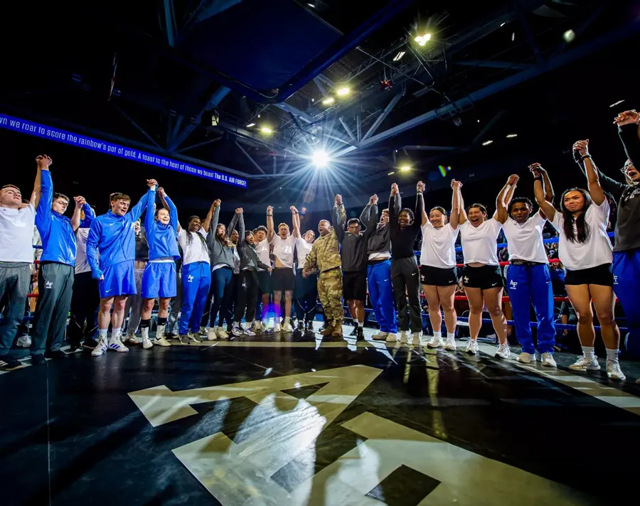 athletes raising hands