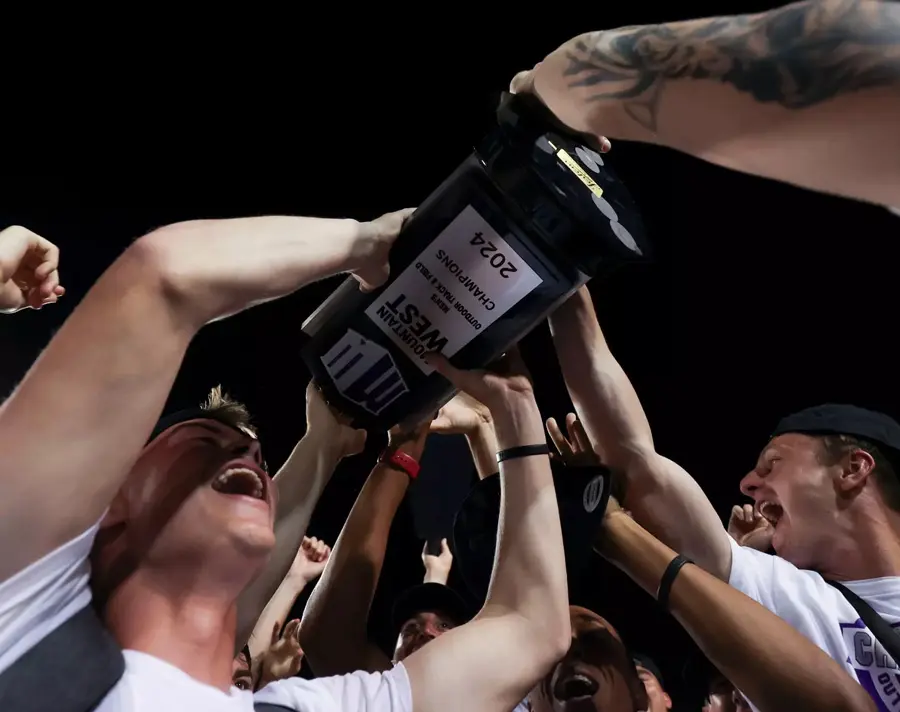 athletes celebrating with trophy