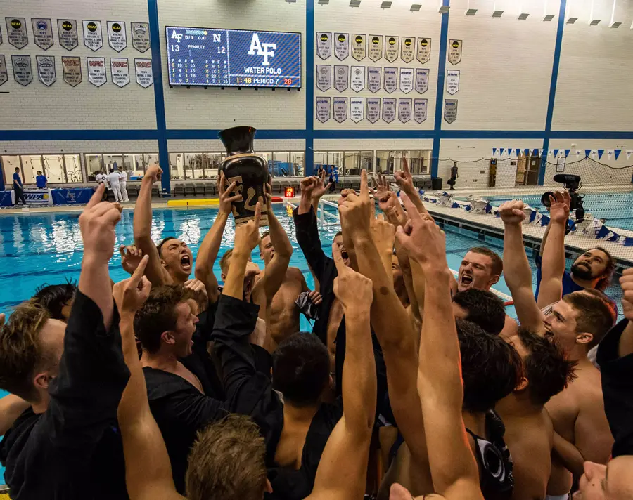 athletes cheering with hands up