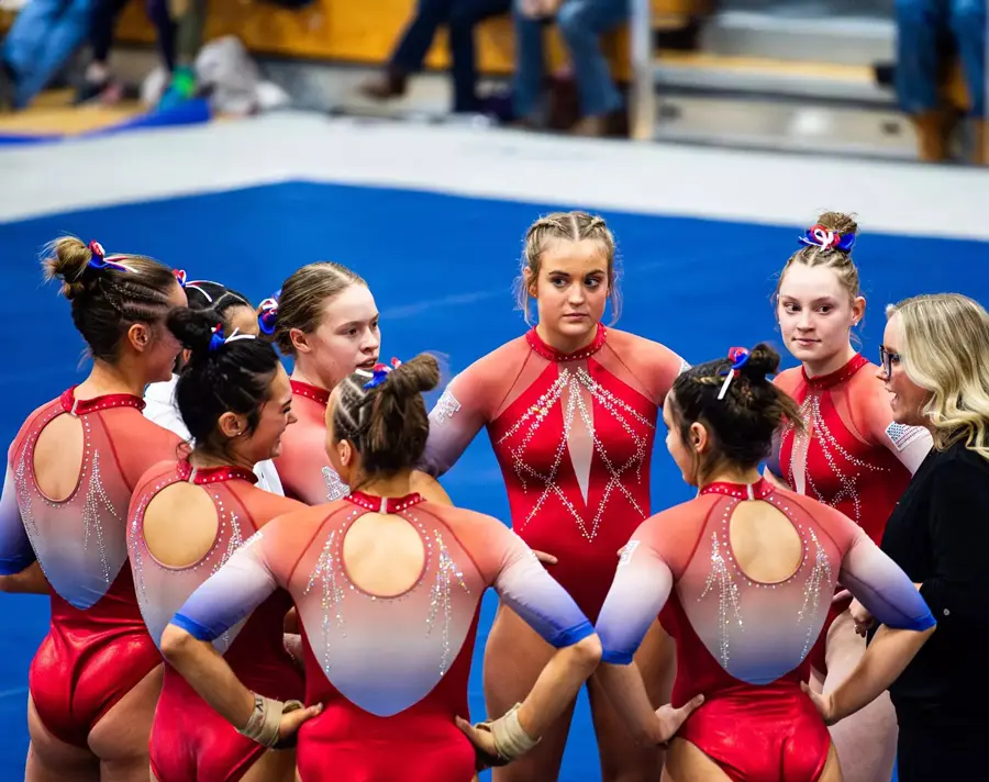 gymnasts in a huddle