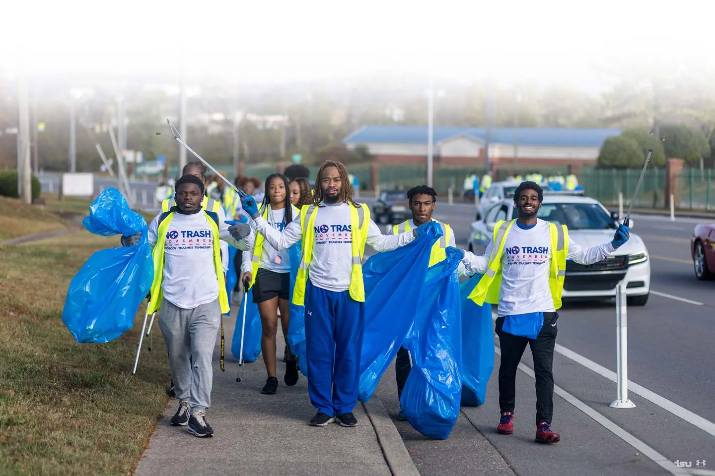 volunteers picking up trash